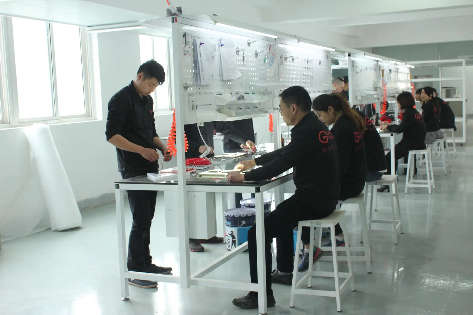 Technicians assembling illuminated LED circuit boards